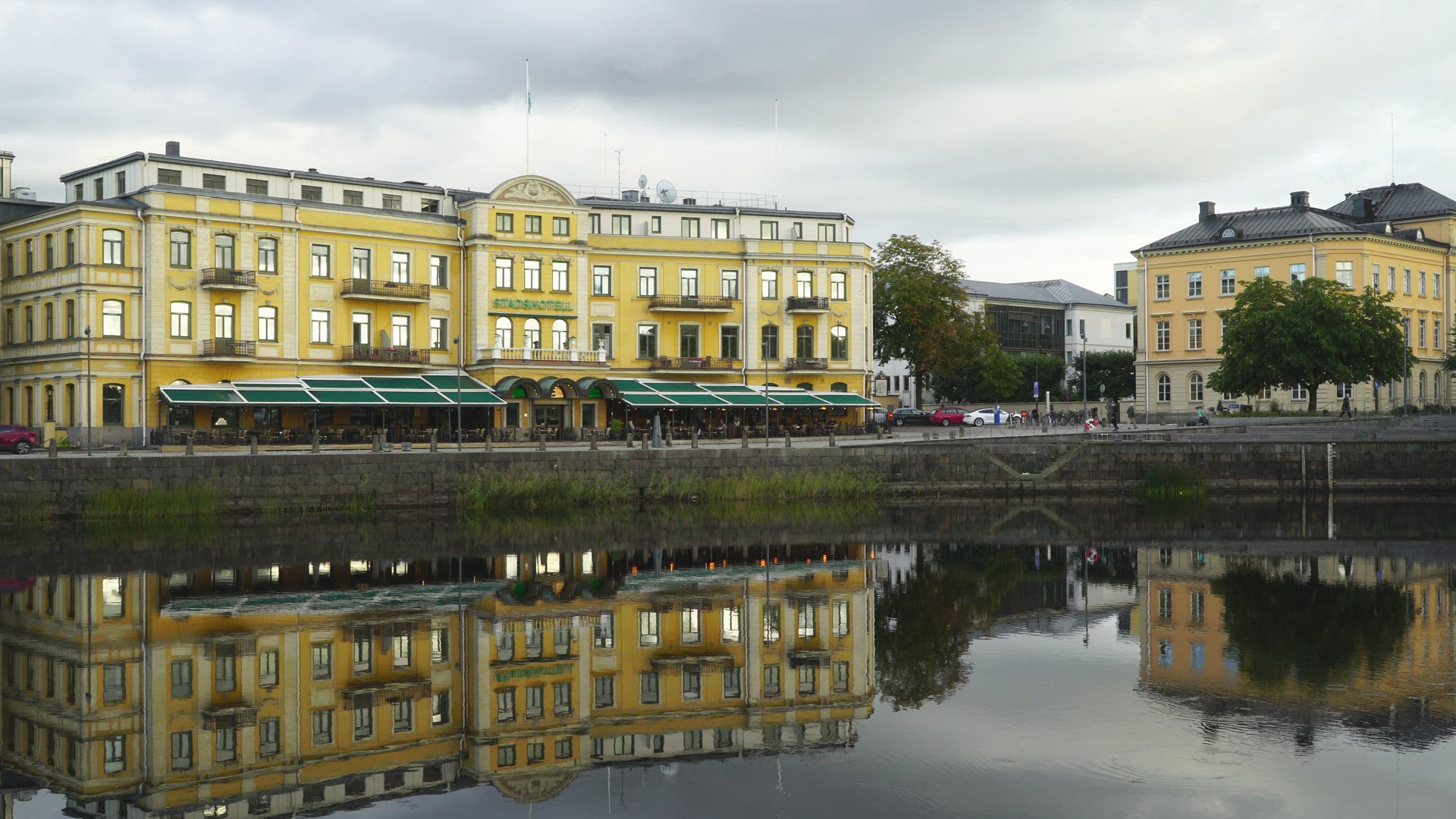facade of houses in central Karlstad - reflections in water