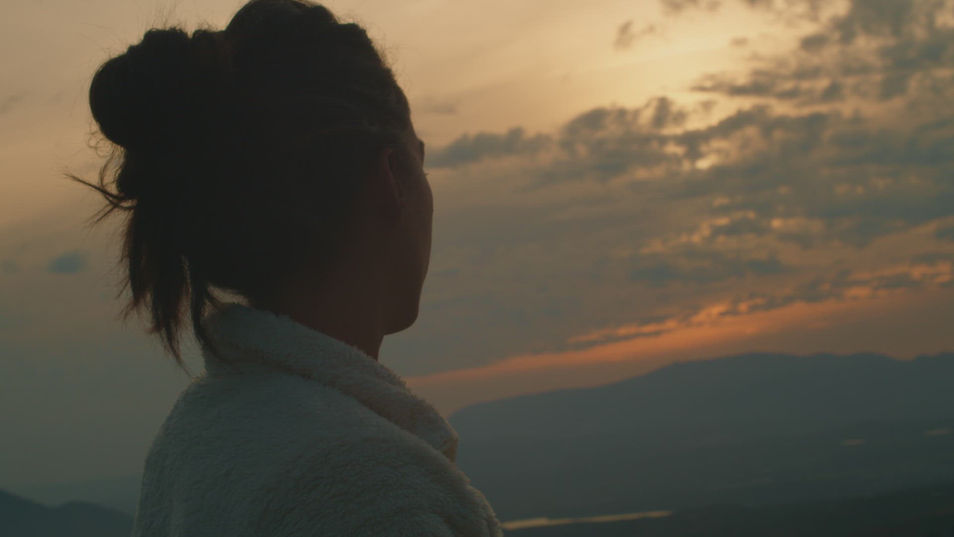 Woman absent at sunse