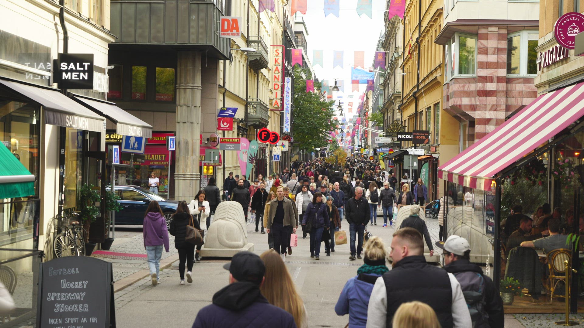 lots of people on crowded street in central Stockholm