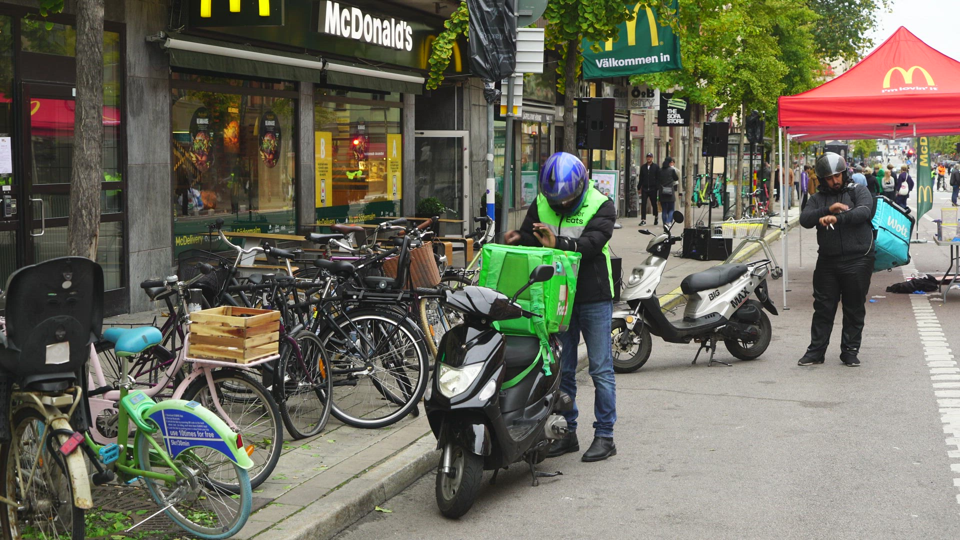 food couriers outside McDonalds restaurant in Stockholm