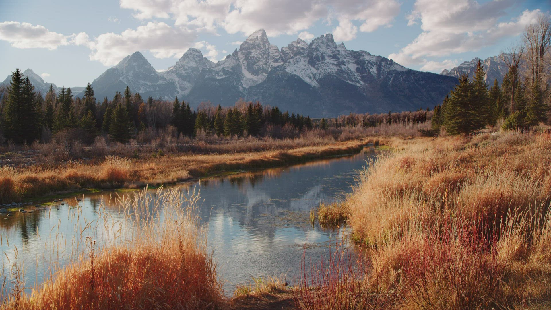 Static shot of Grand Tetons and snake river