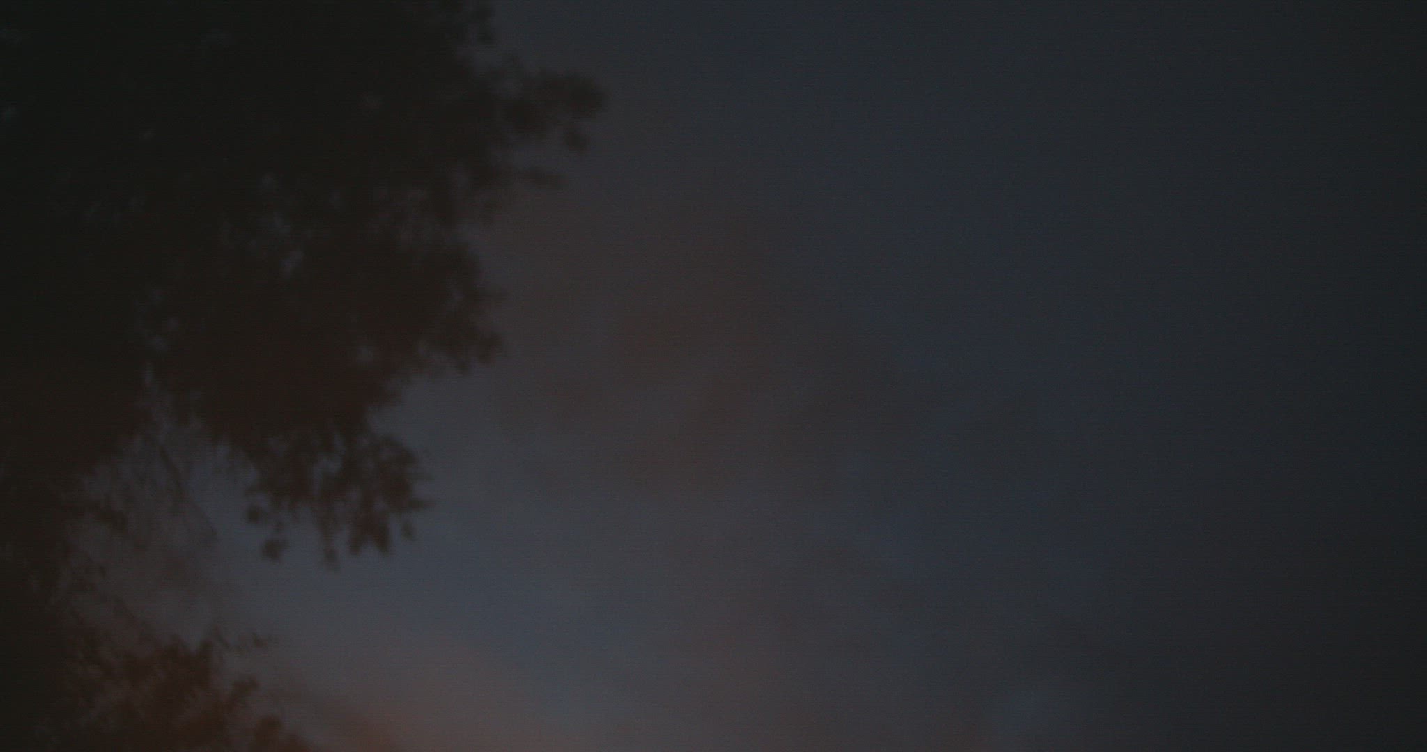 Tilt down from sky to bonfire