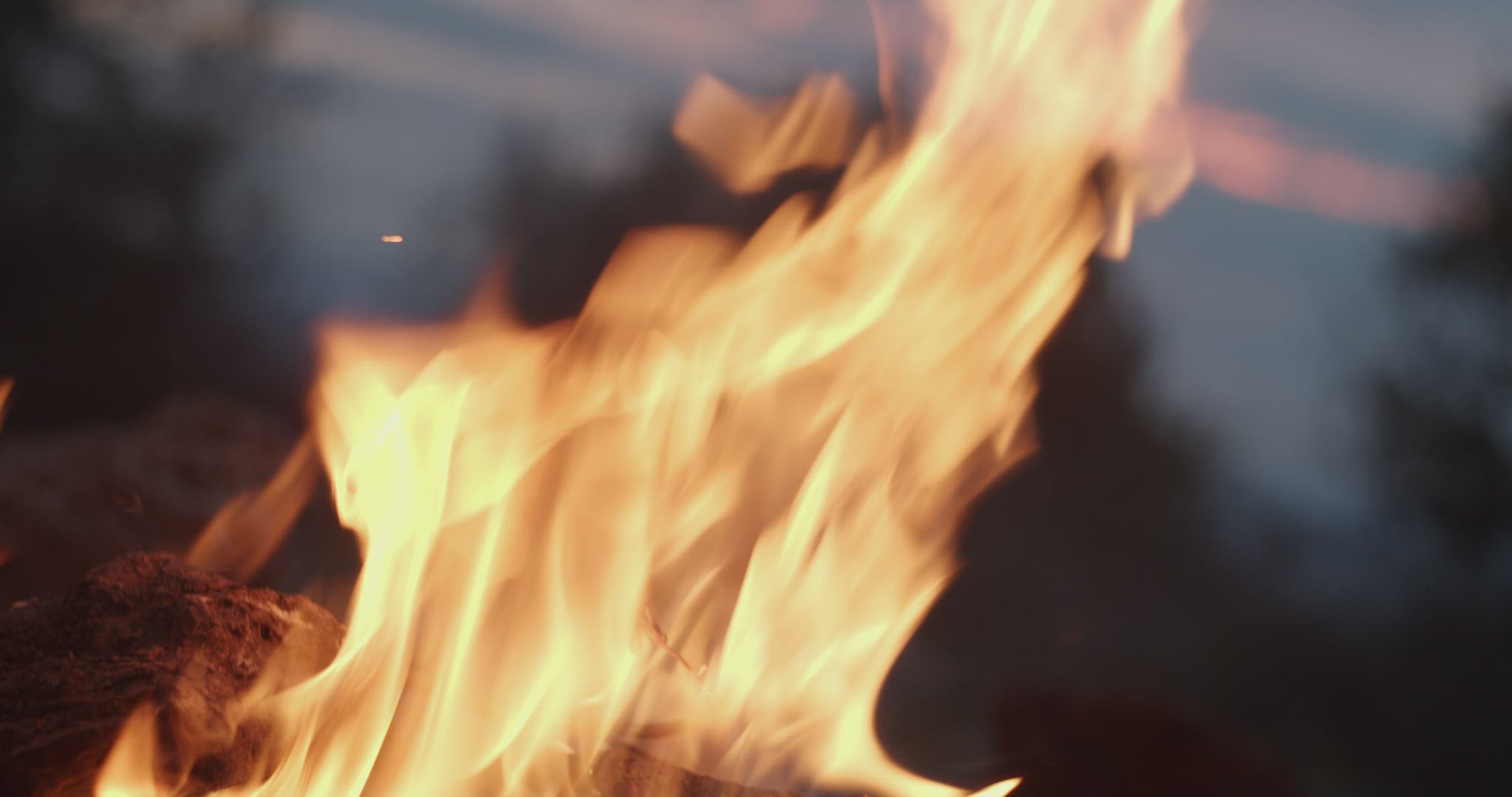 Woman's hand caresses fire