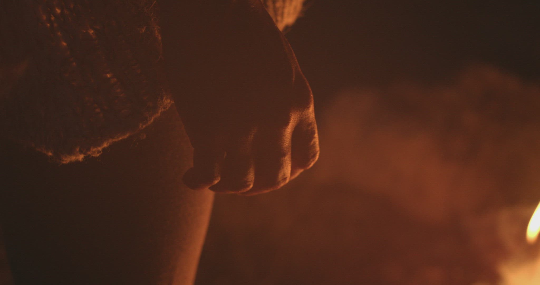 Woman’s hand with fire background