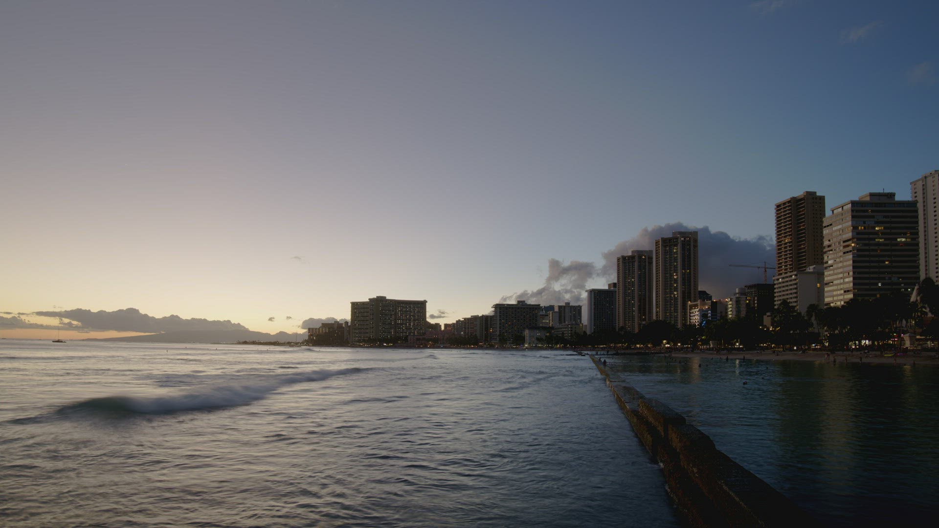Honolulu Hawaii Waikiki Beach Walls Day to Night Time Lapse Pan Right to Left