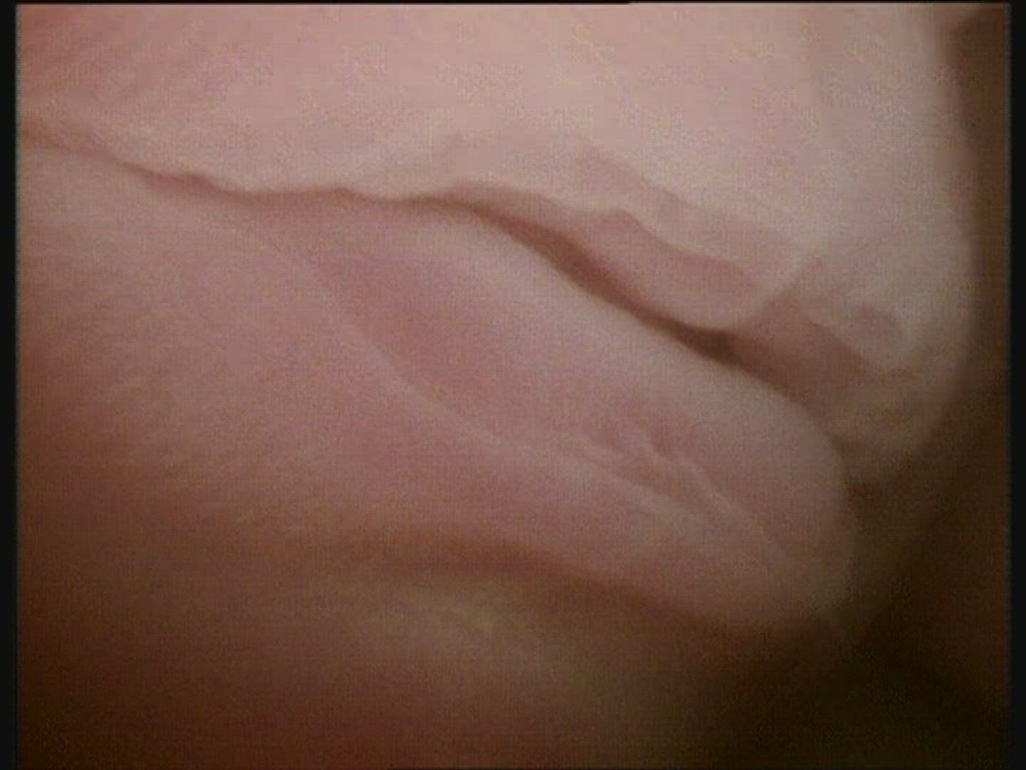 Foetus 24 weeks in the womb. Details of mouth, nose, closed eye, facial hair