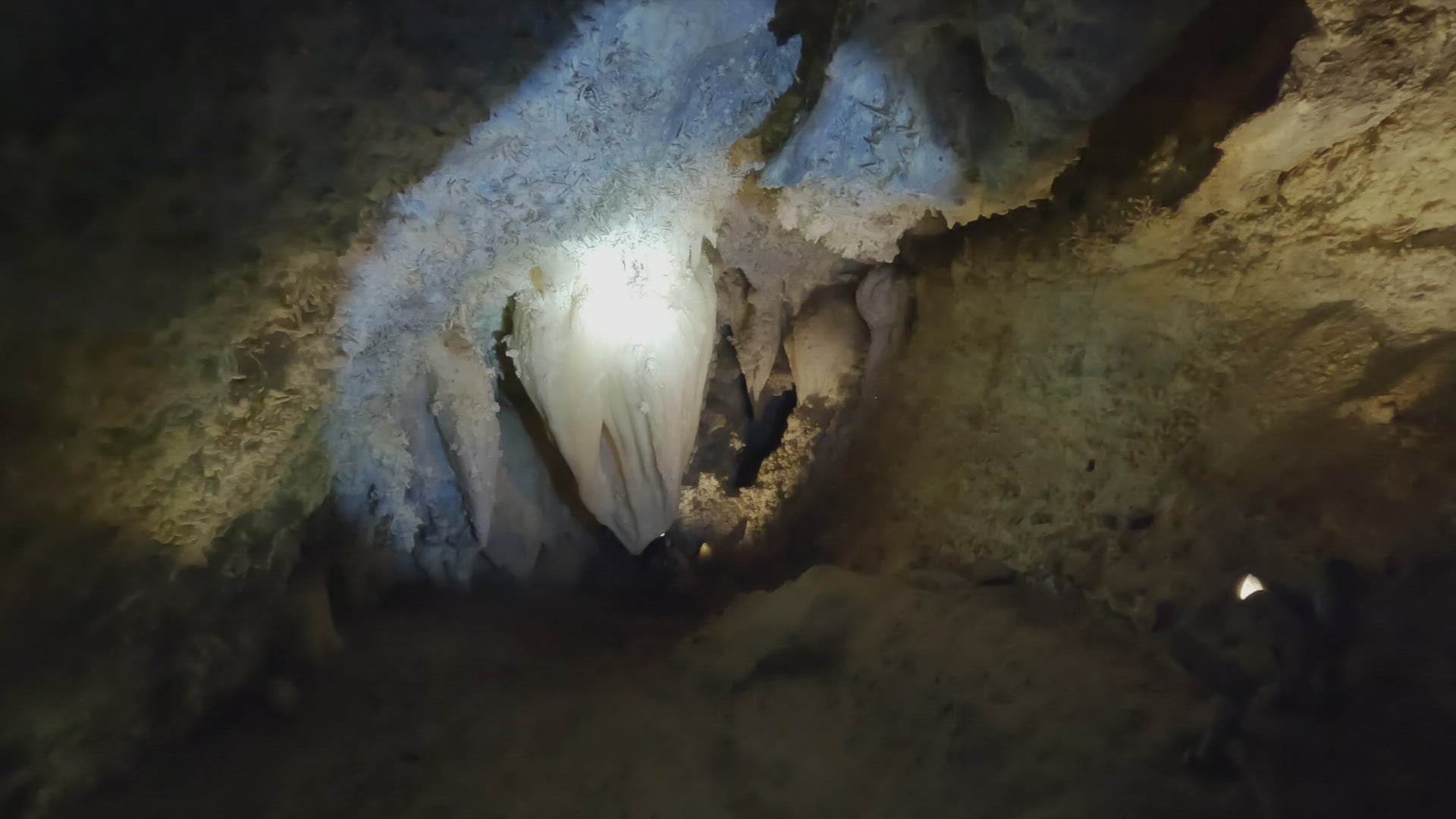 Flashlight shining on the Heart of Timpanogos in the cave
