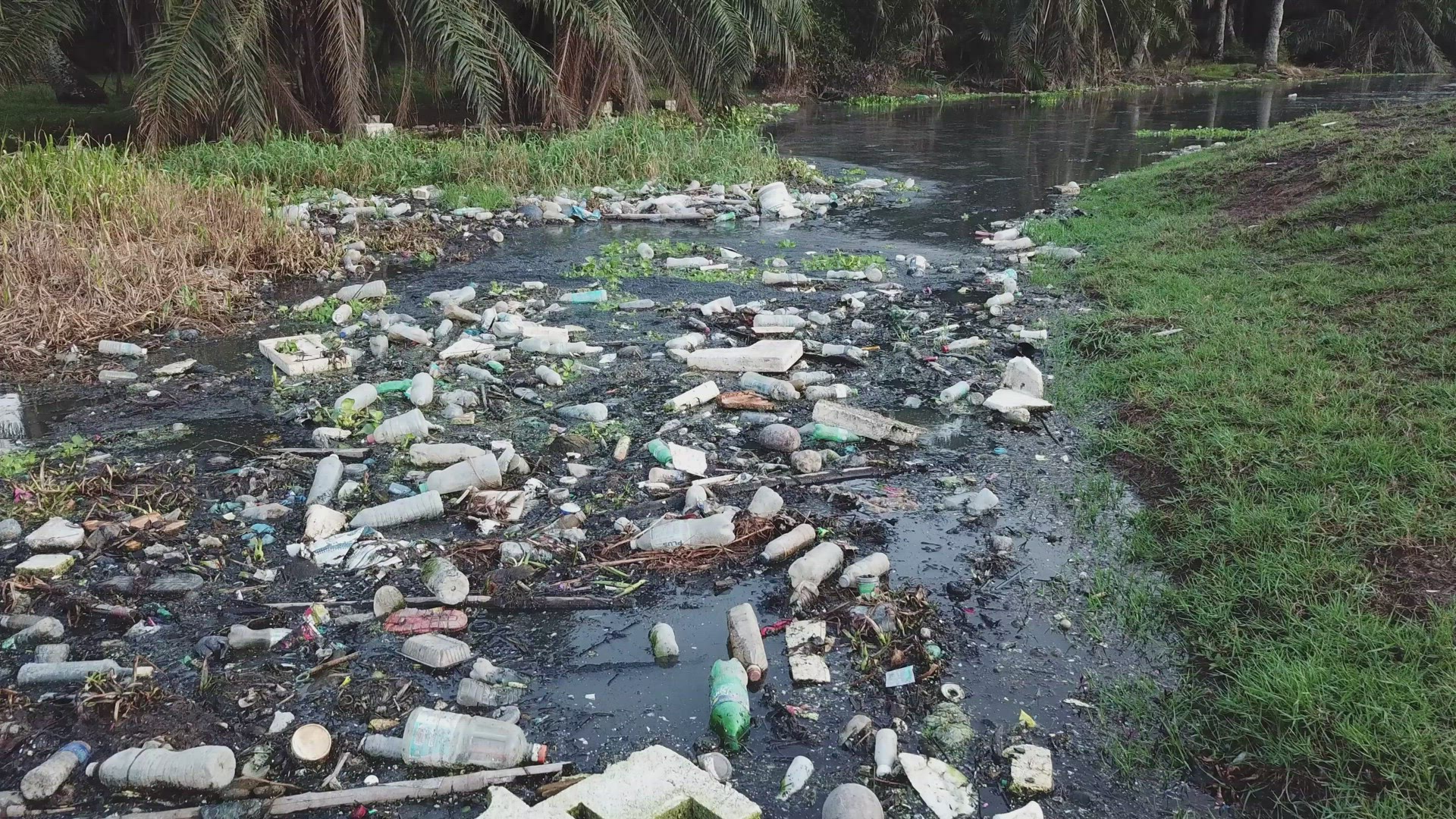 Move toward dark river full of rubbish garbage