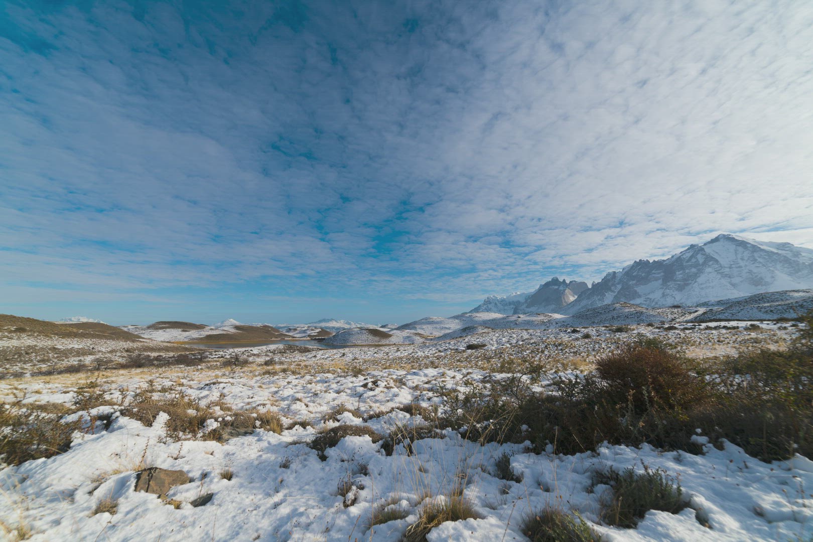 Time Lapse Of Thin Wispy Rolling Clouds Under Blue Skies Over Torres del Paine