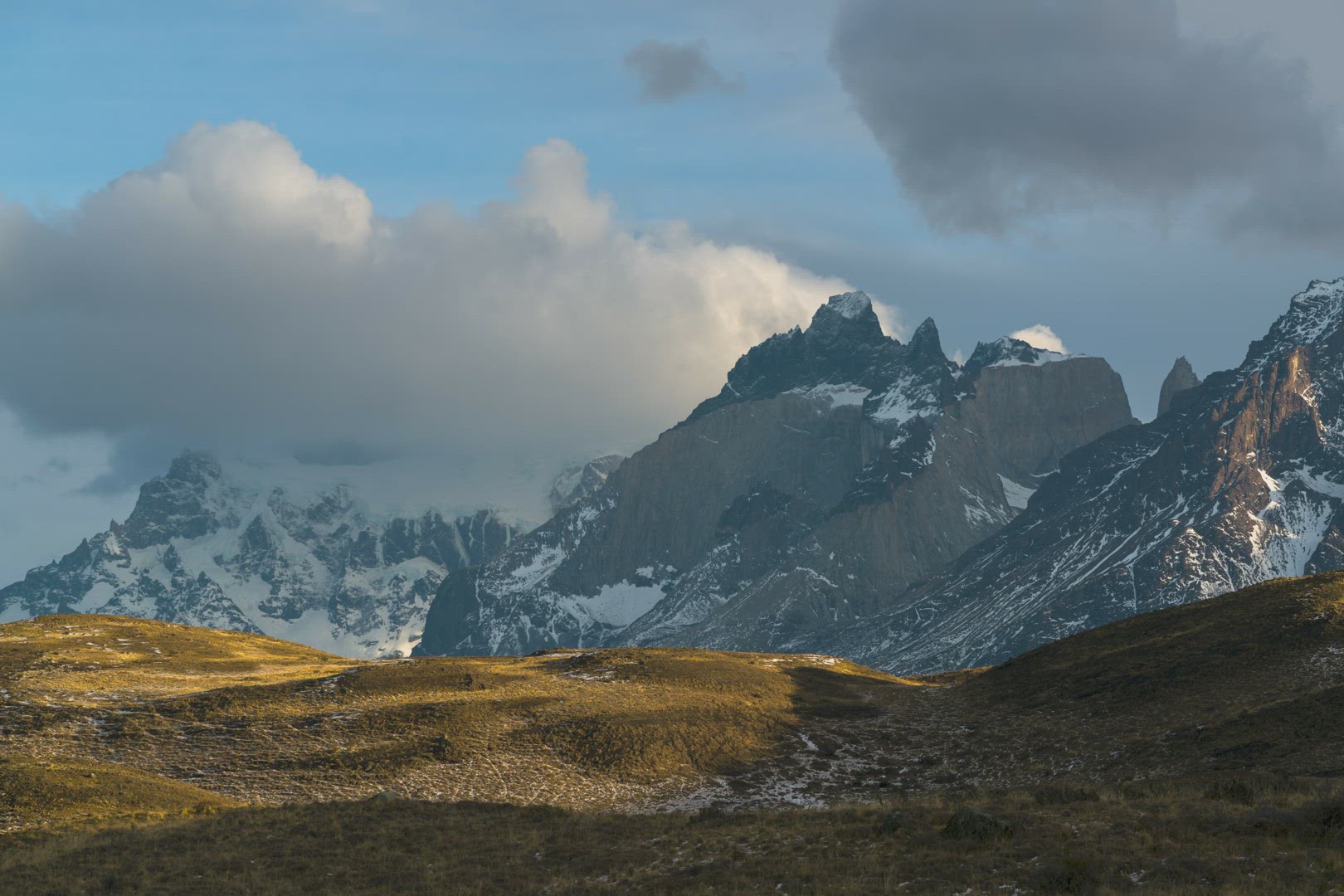 Clouds Rolling over Horns of Paine Mountain Side Landscape