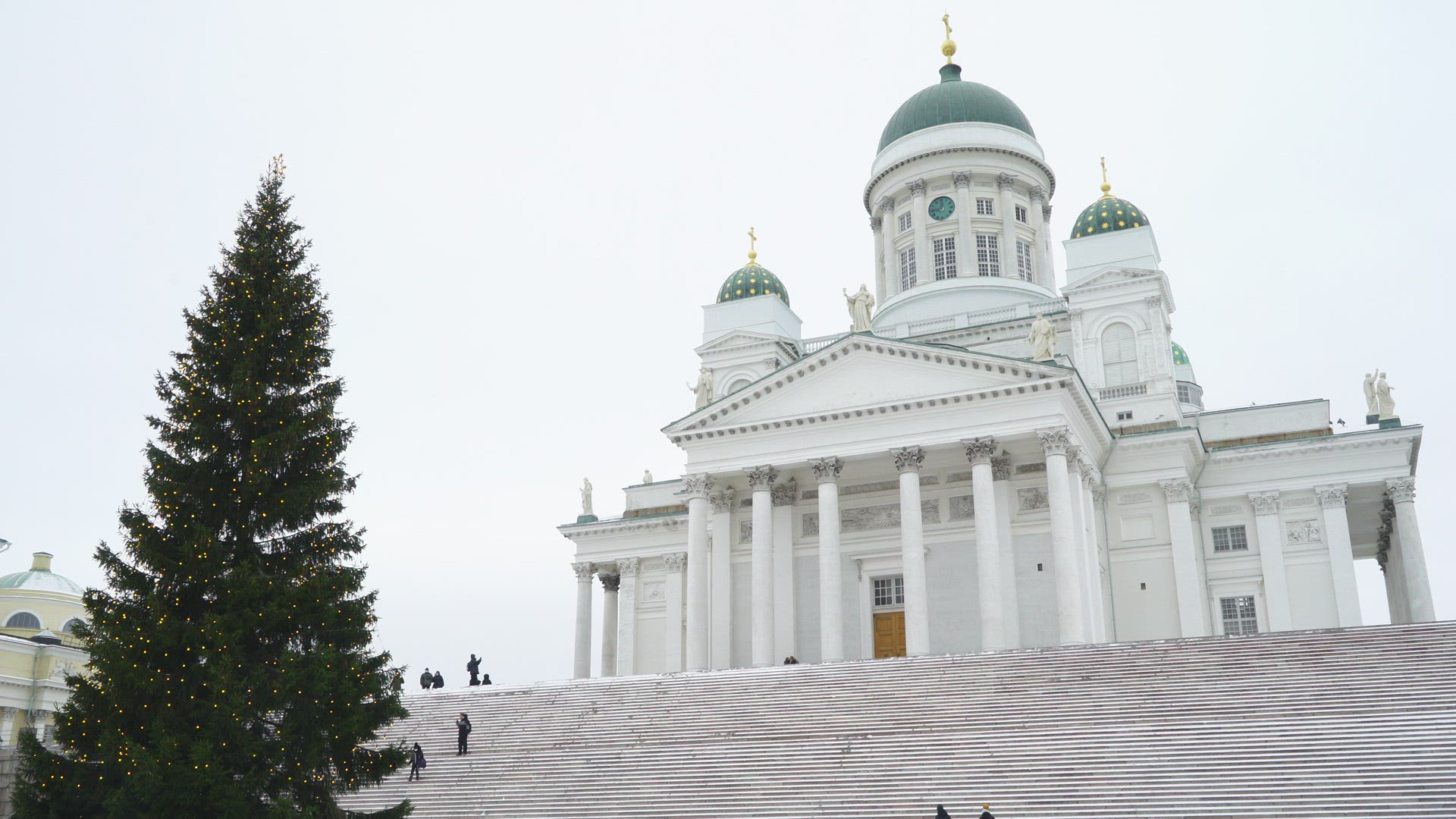 boys running up stairs outside Helsinki Cathedral, Finland