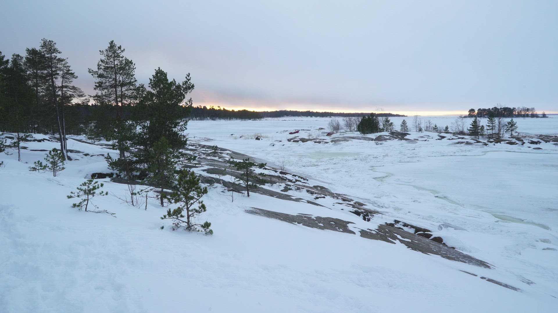 boy walking in deep snow - coastal landscape - Fäboda - Finland