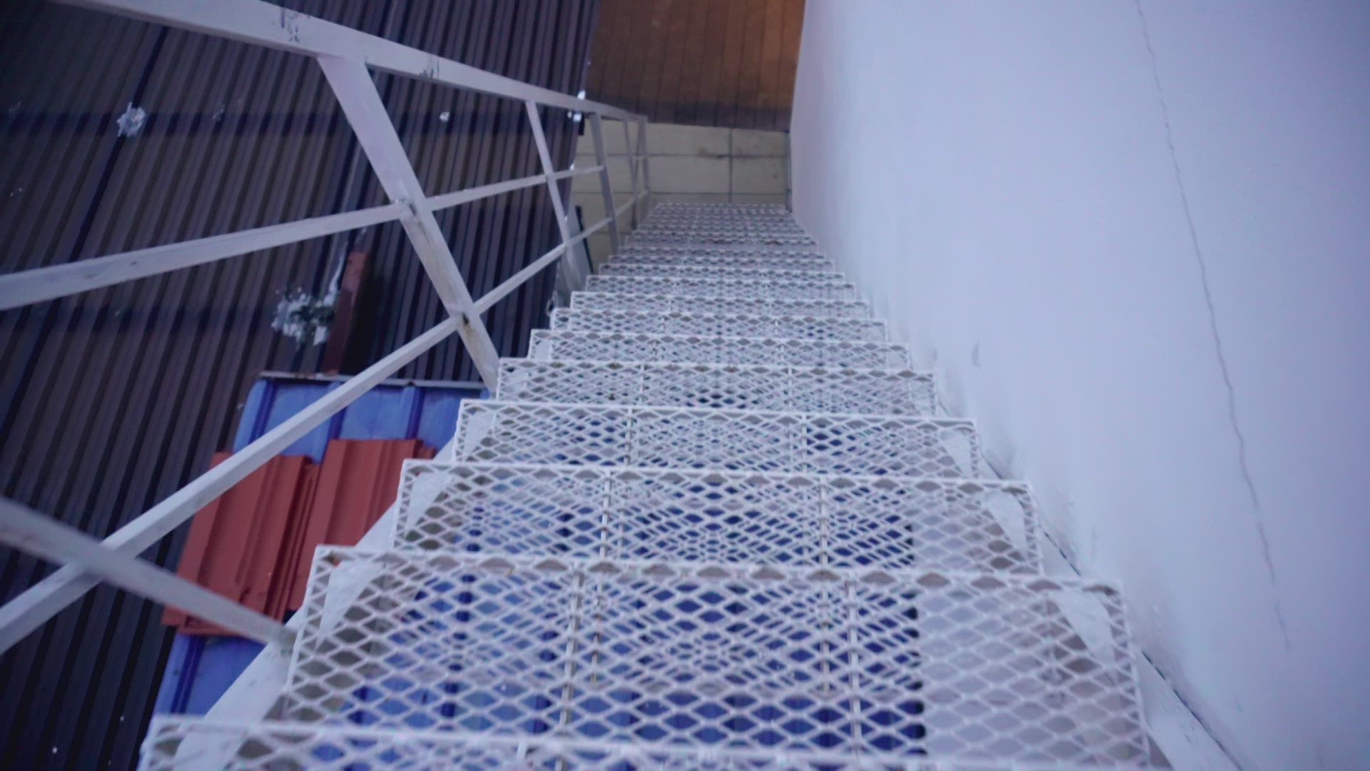 Walk down the white steel staircase