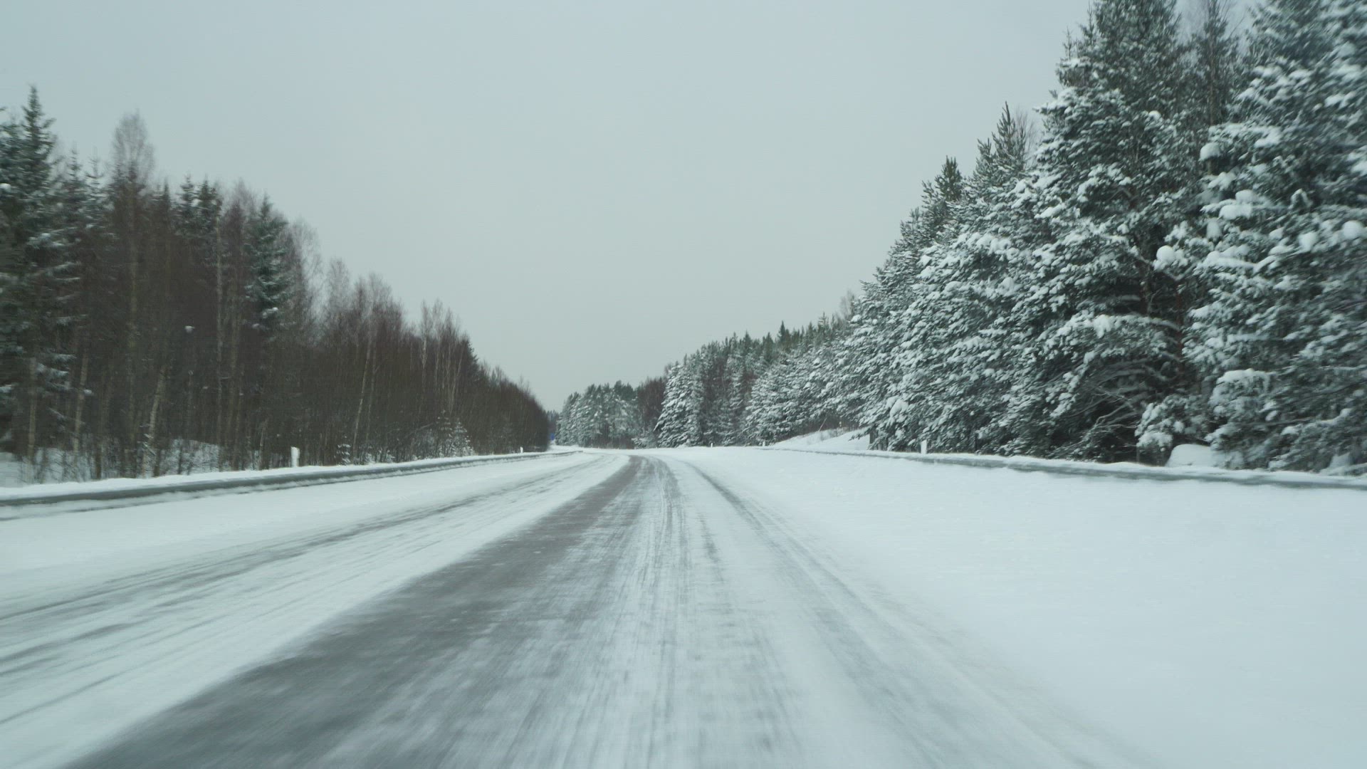 pov driving on wintry road - car passing by - overtakes