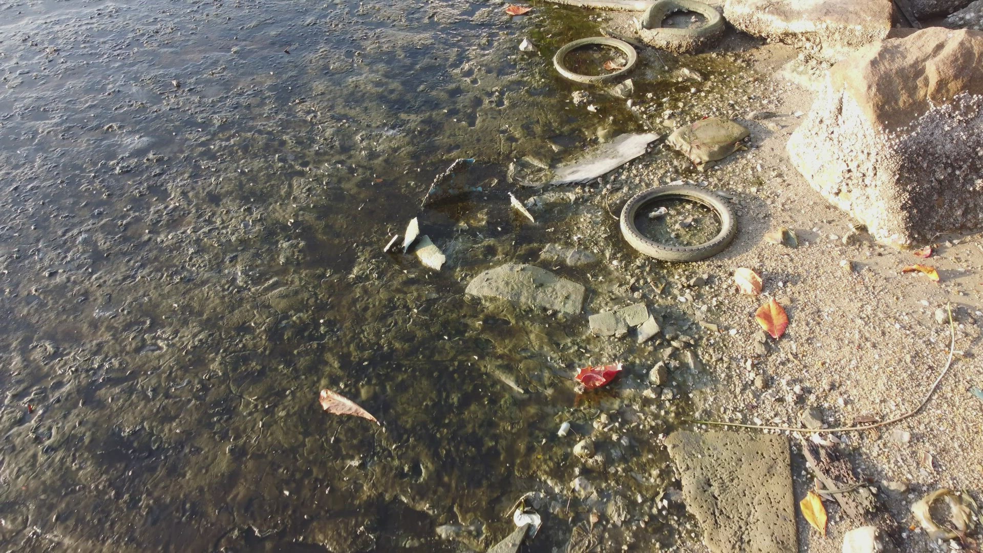 Top view of tire rubbish beside coastal