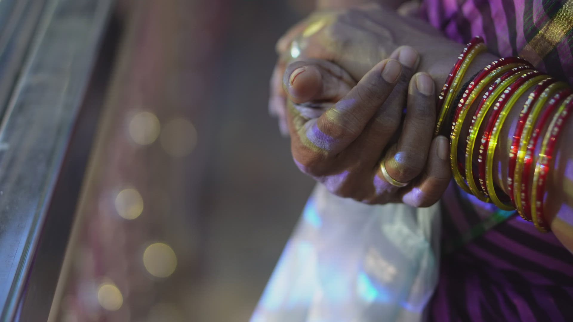 Close up the hand of Indian girl hand with jewellery bracelet.