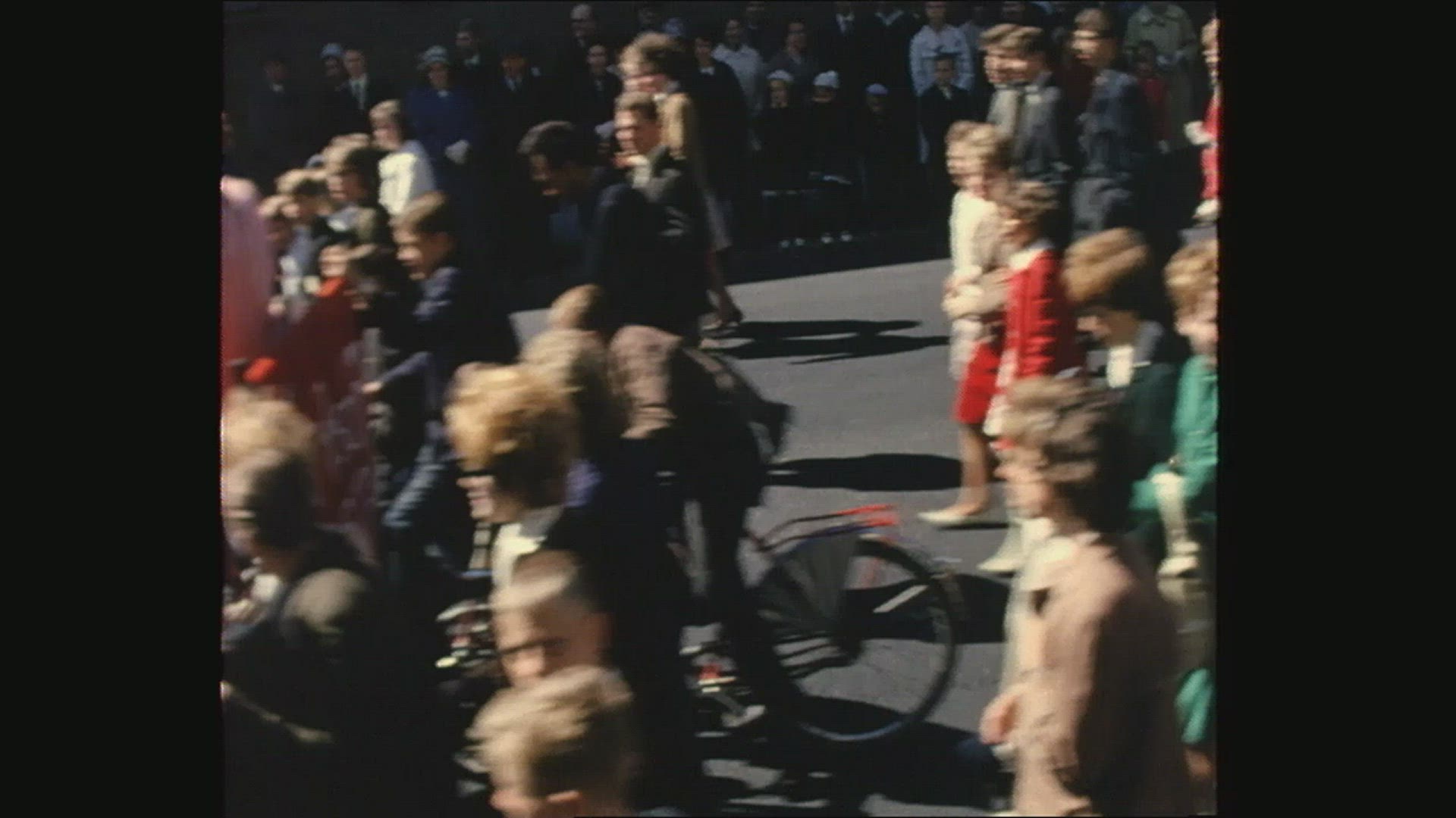 crowd of people walking in street - 1960´s
