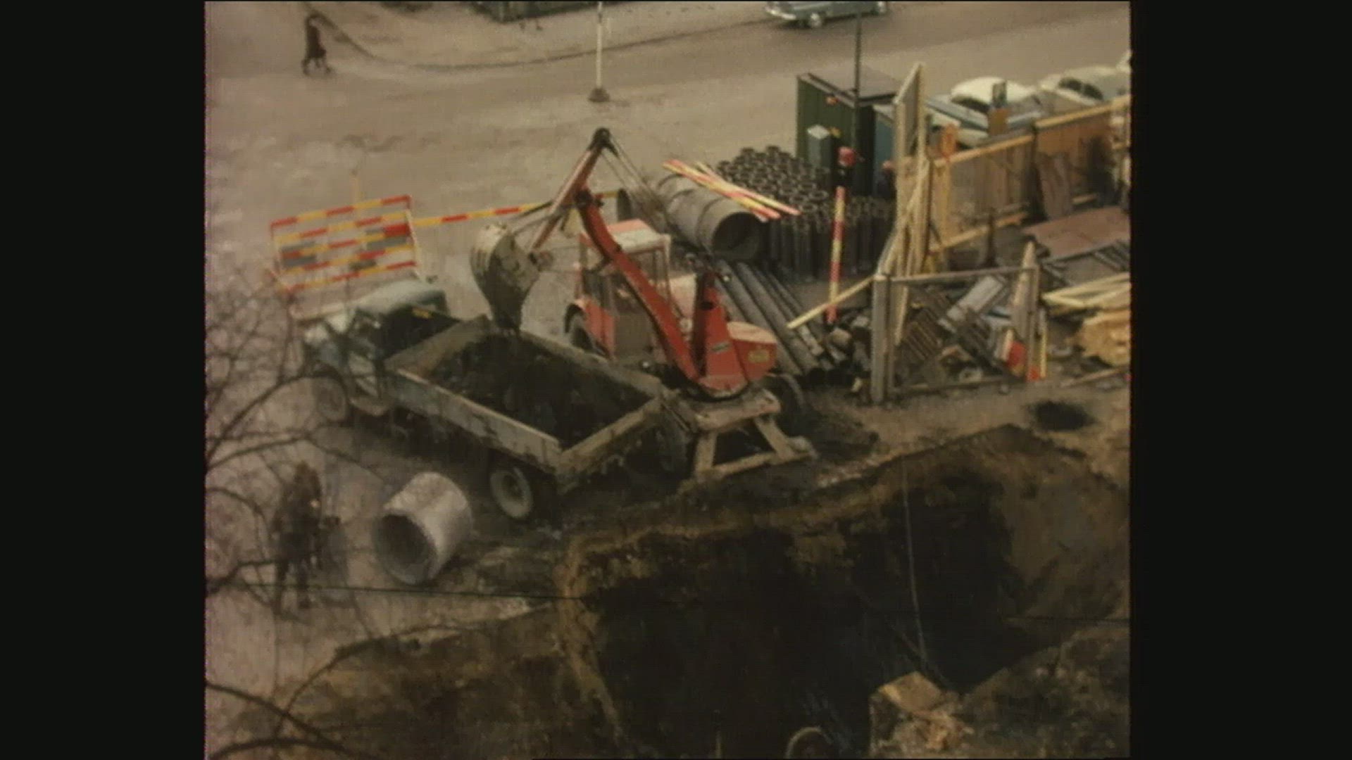 excavator digging in ground - street - 1960´s
