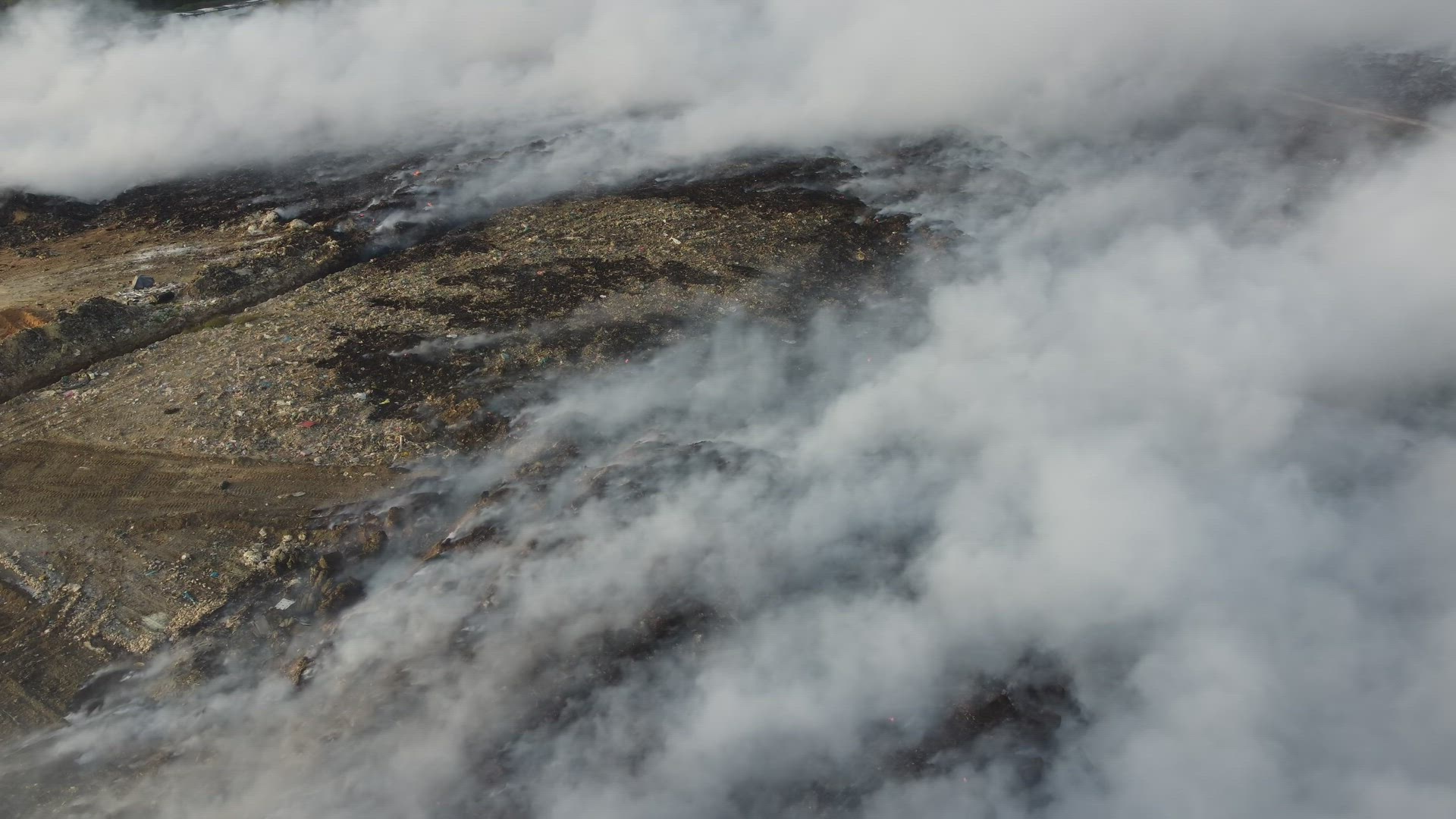 White smoke released at rubbish dump site