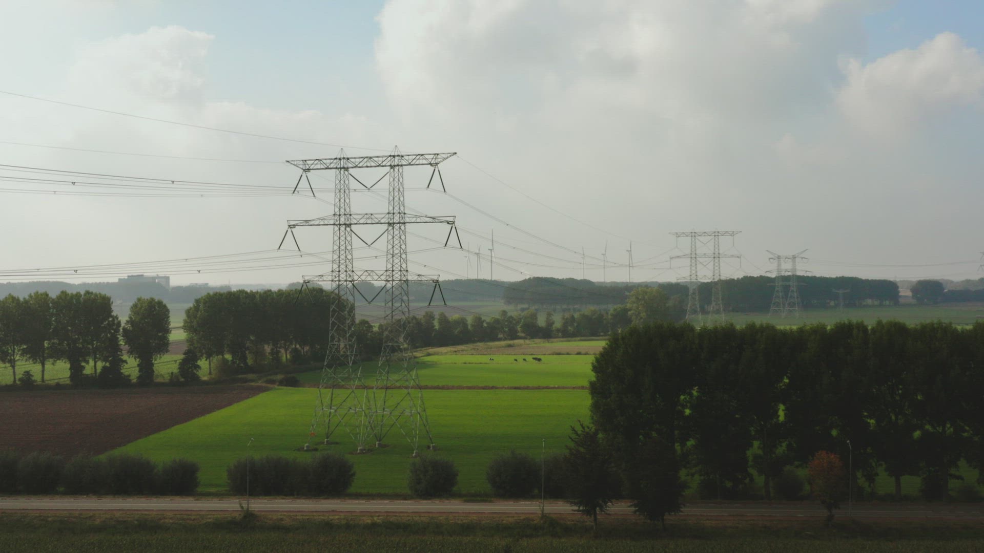 Electricity pylon in green field