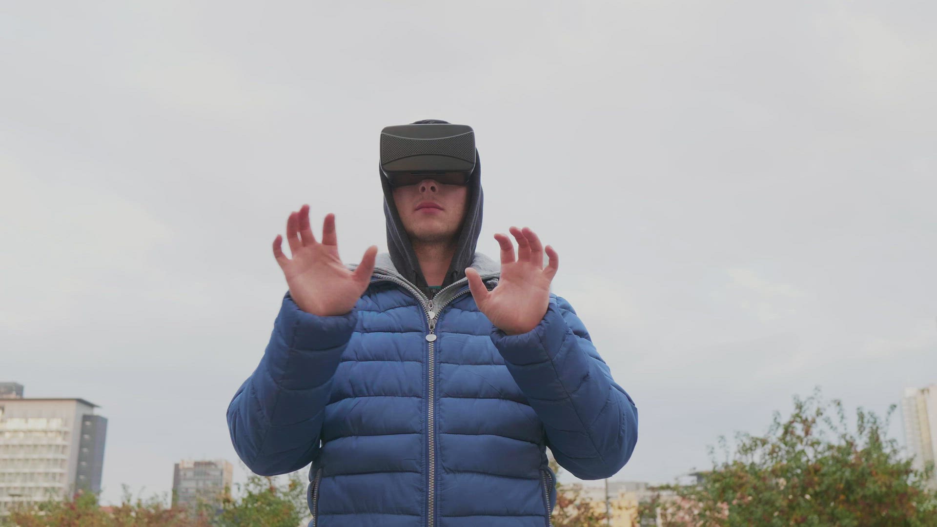 Man with VR goggles in city
