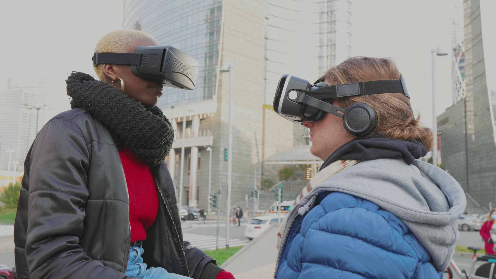Man and woman with VR goggles in city
