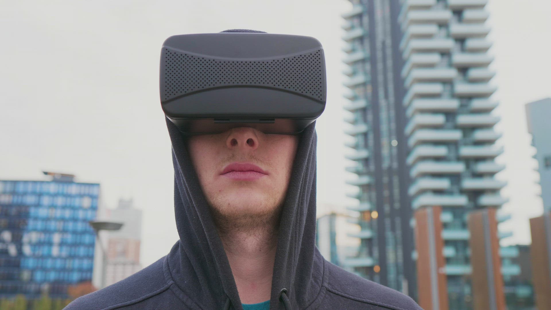 Man with VR goggles in city