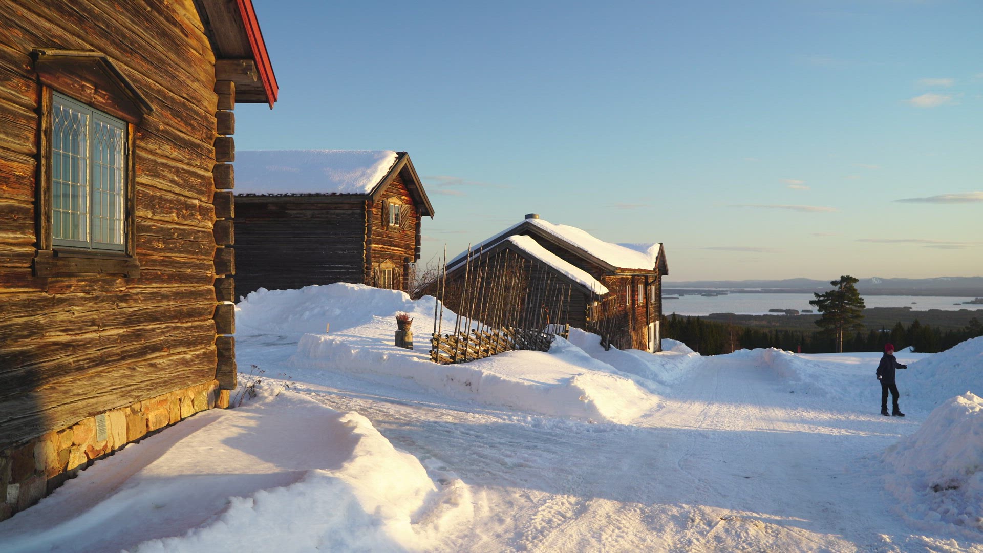 view old houses in Fryksås - boy with snowball playing 