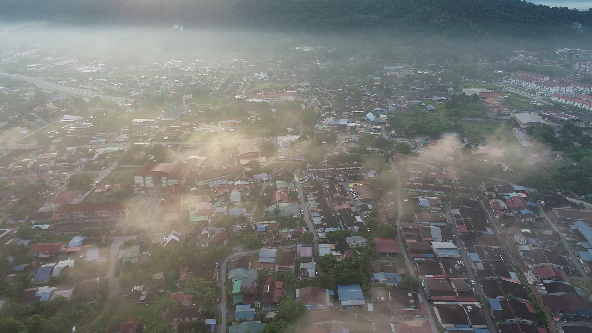 Aerial view shinny cloud over Malays rural housing area
