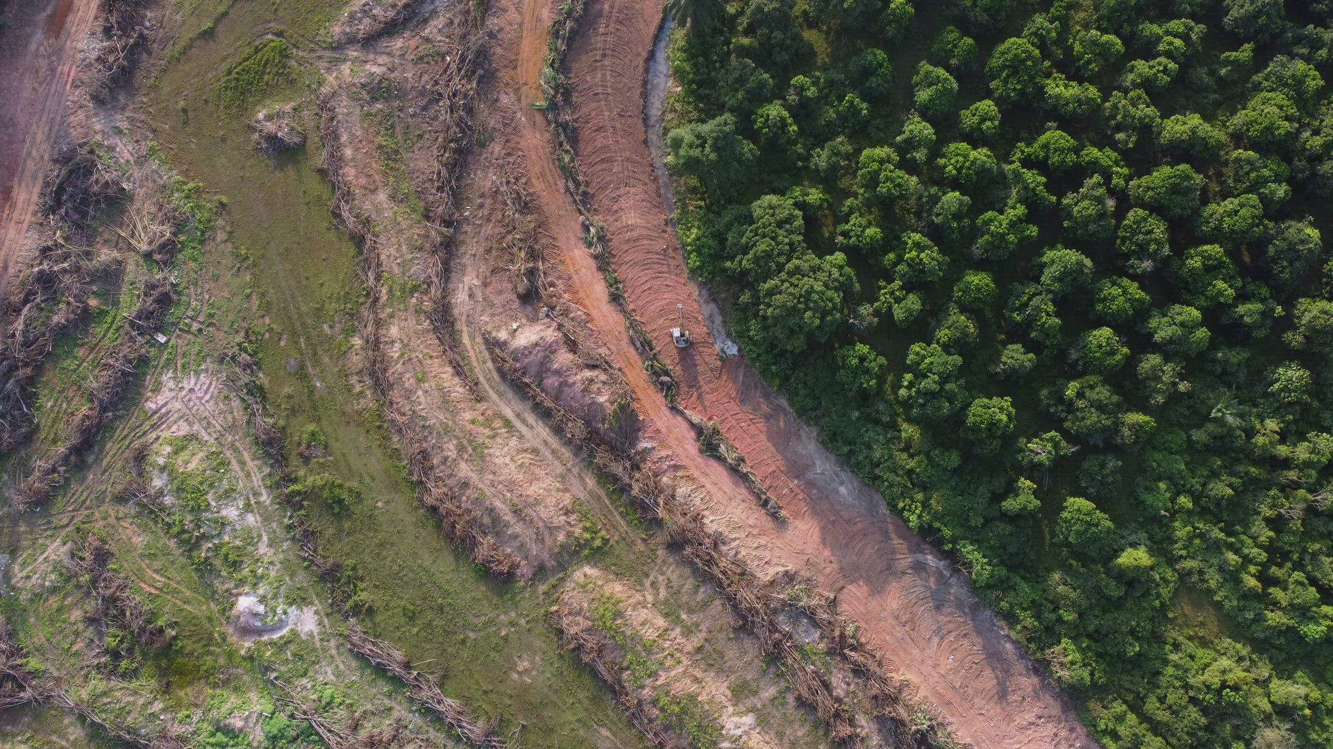 Aerial view following excavator move at land clearing area