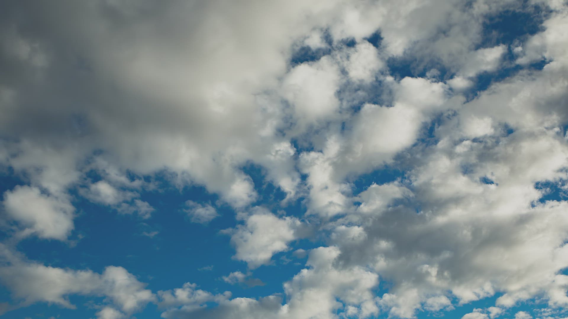 Clouds transform and change in a blue sky