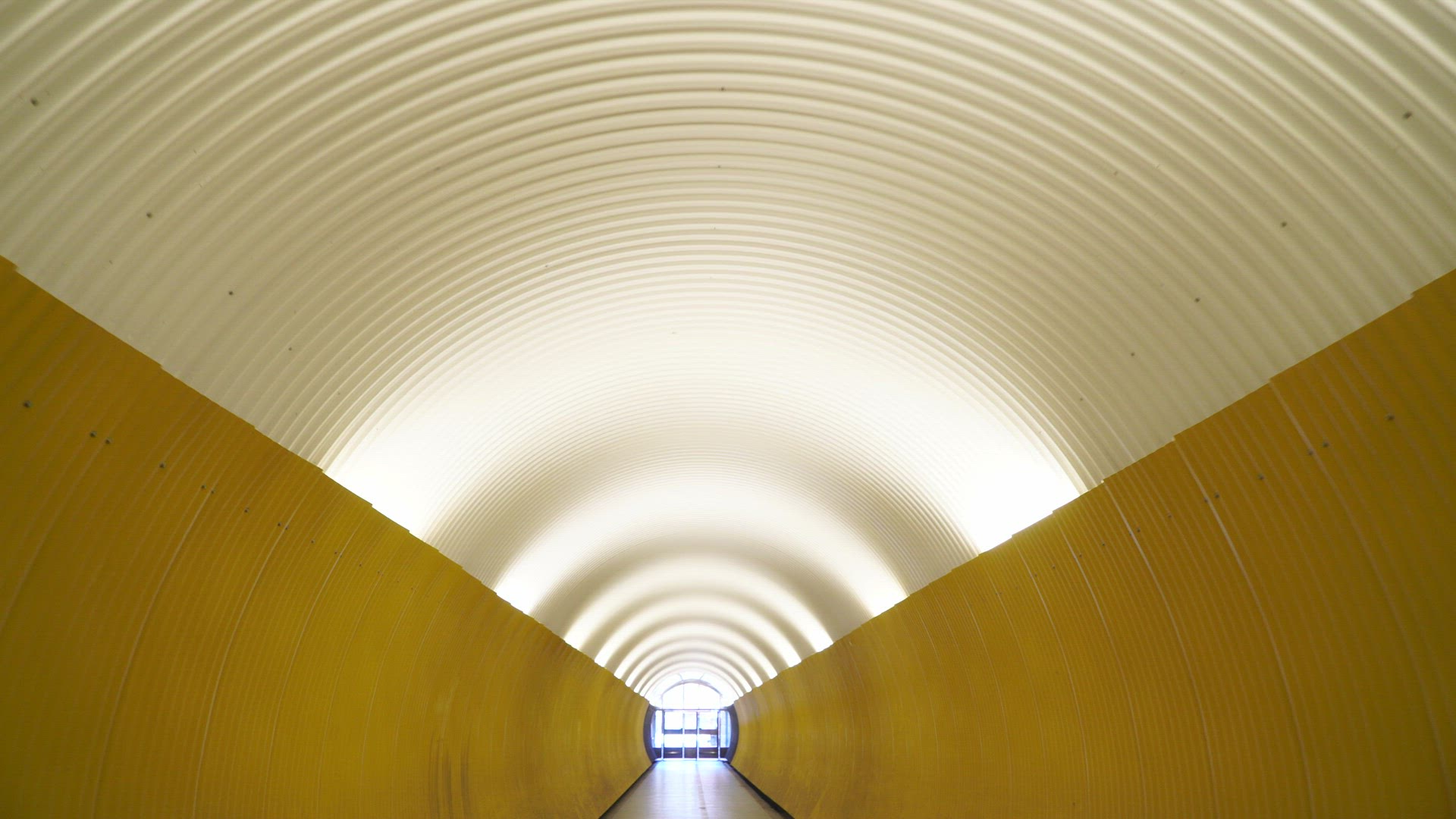 pov through tunnel - yellow walls - lights