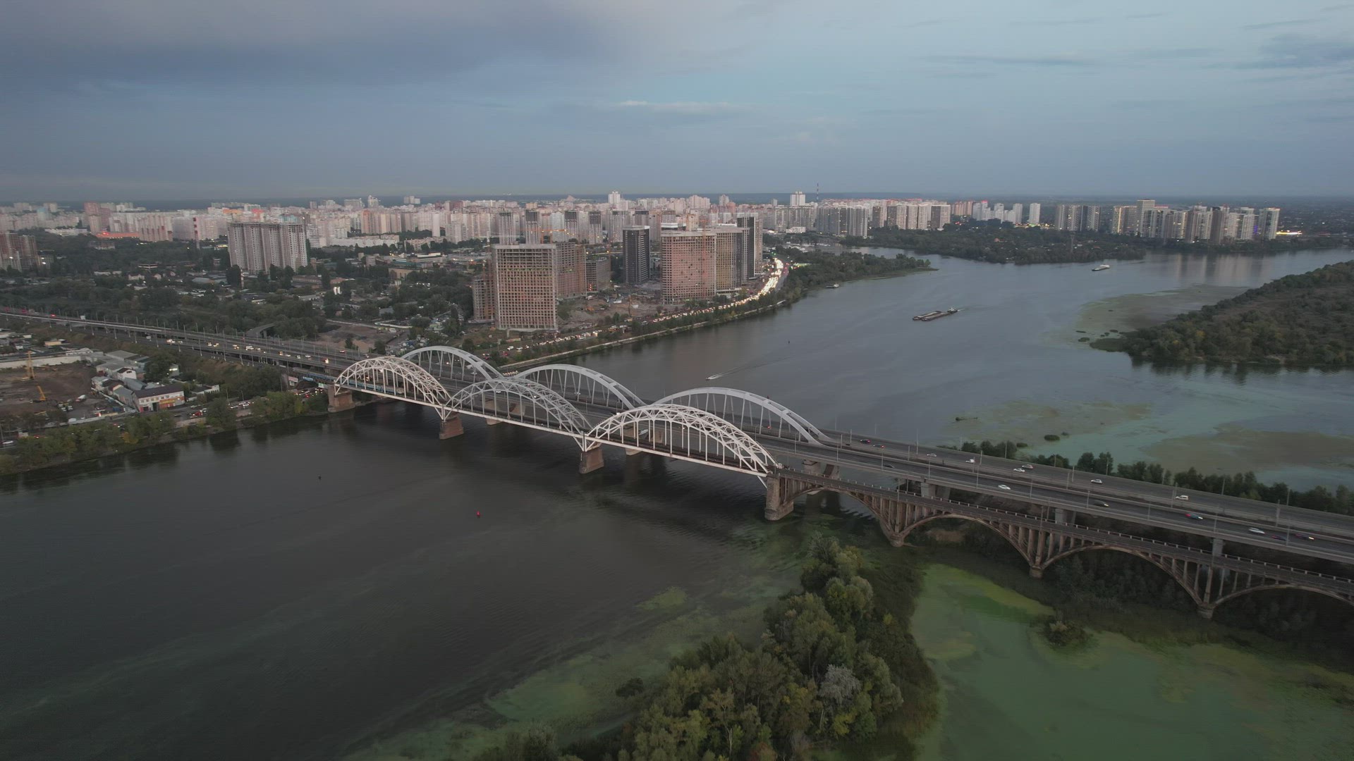 Top View Of The Dnieper River And Darnytskyi Bridge At Sunset
