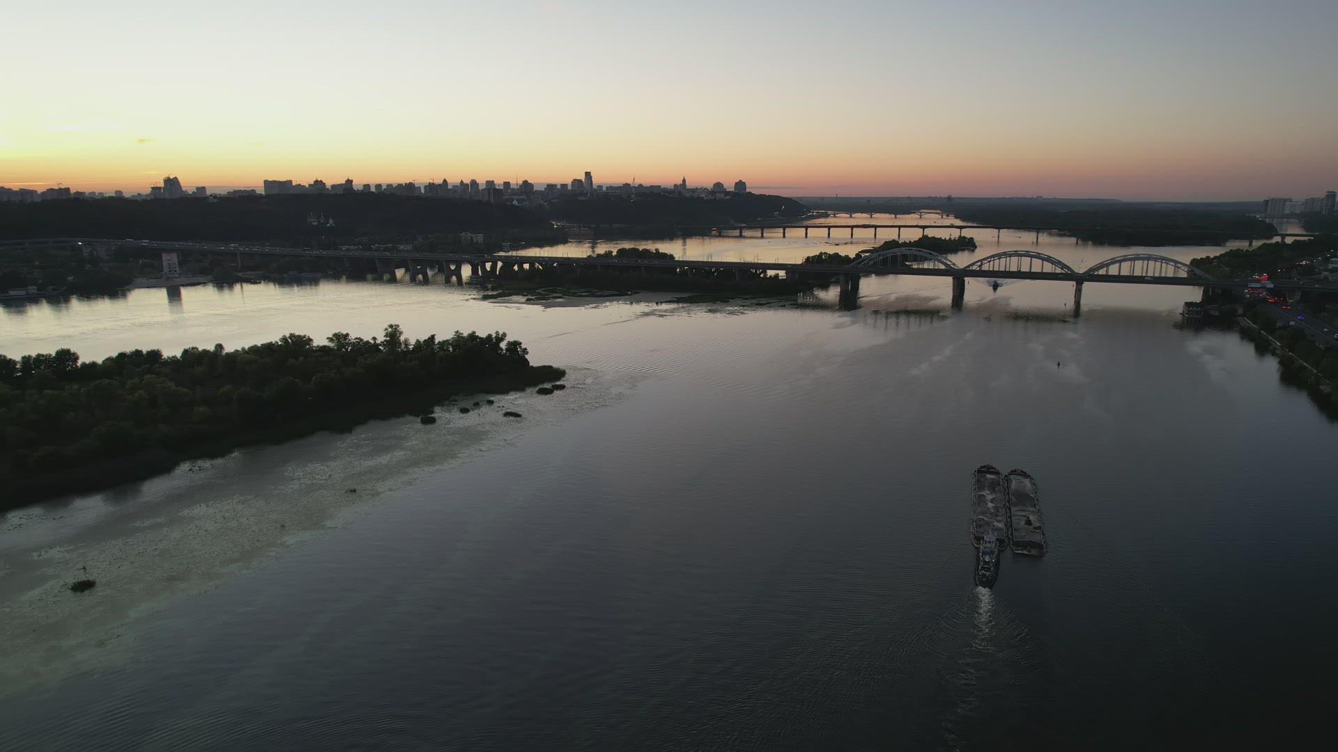 Aerial View Of The Calm And Serene River Dnieper In Kyiv City At Sunset