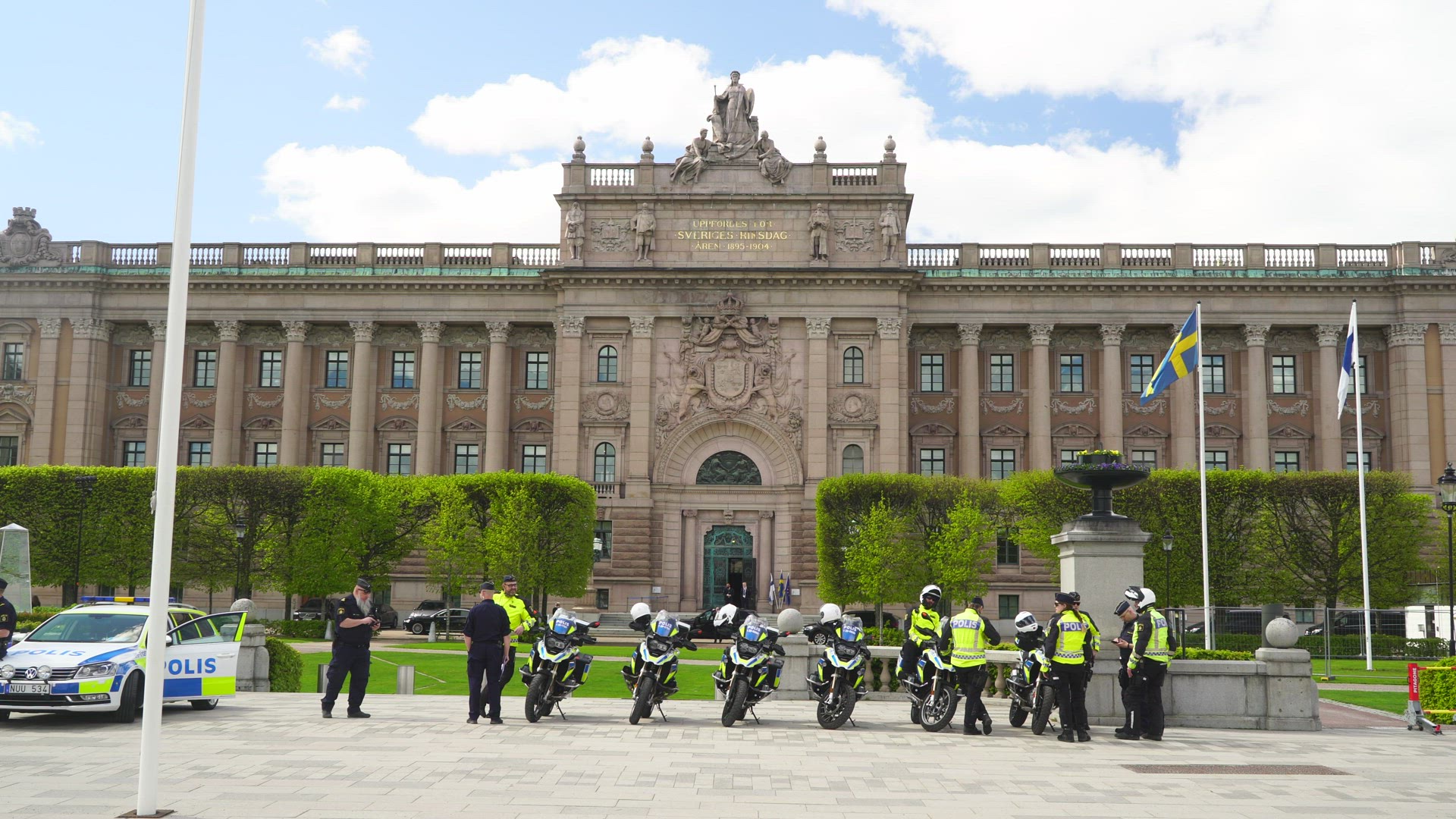 policemen with motorcycles outside Parliament building in Stockholm