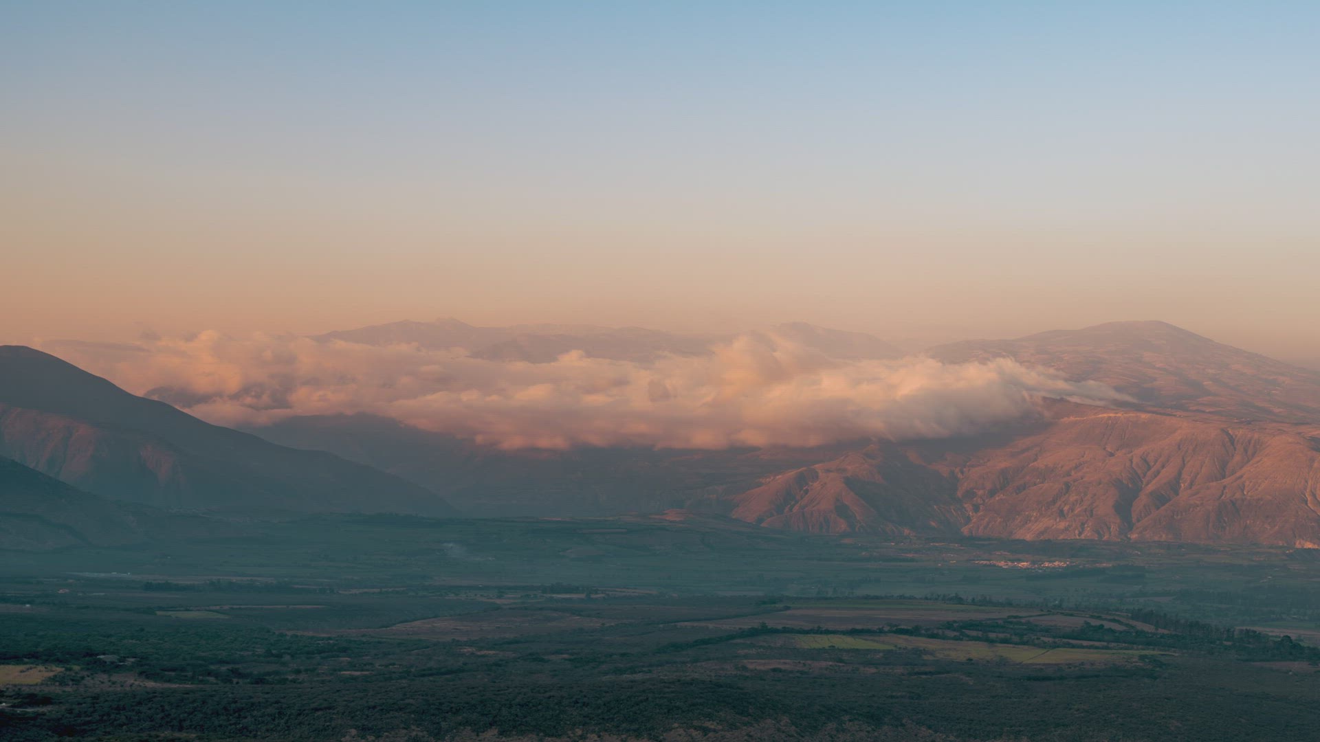 Quito, Ecuador, Timelapse - The mountains in Ecuador during the sunset with warms sun lights over th
