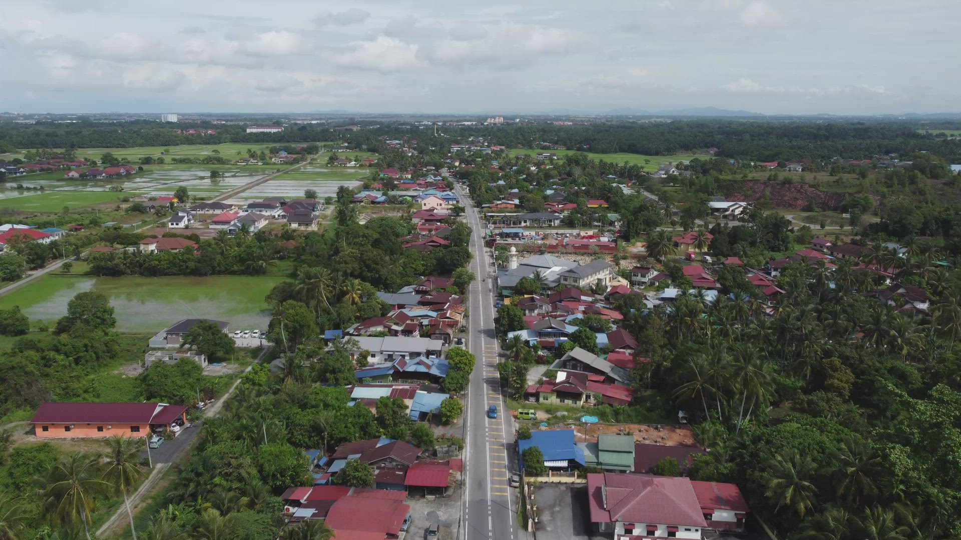 Aerial asphalt road at Malays kampung