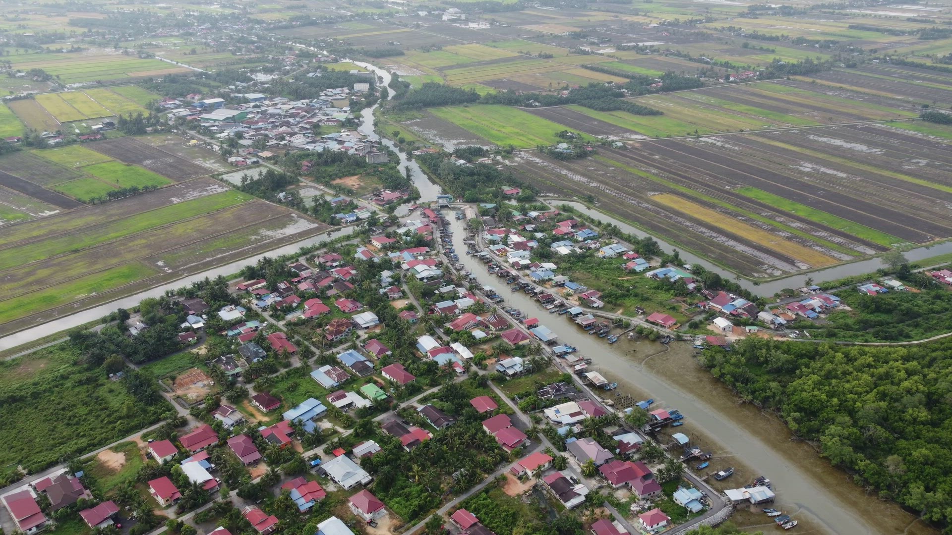 Aerial view fishing village and kampung house beside the river