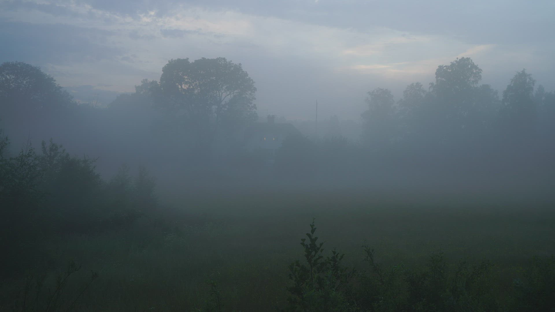 fog over field - house in background - mist