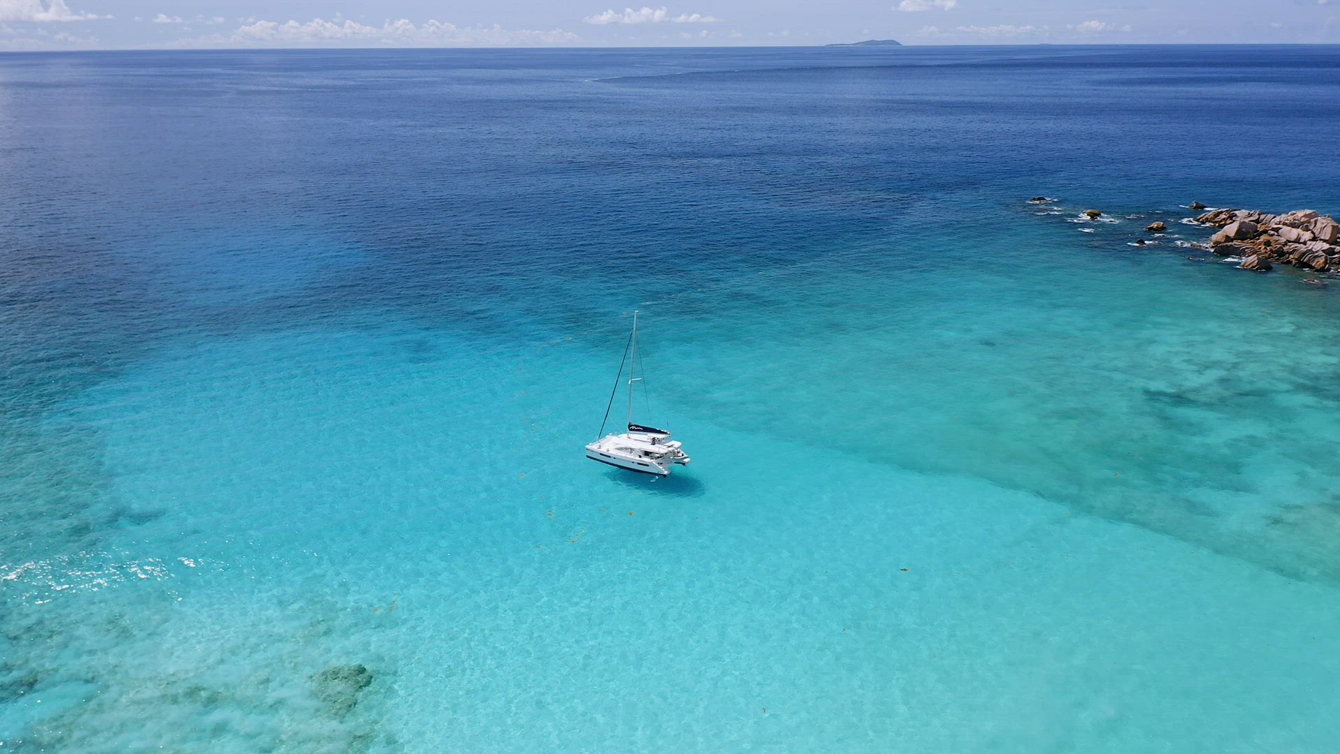 Top 4k drone panoramic footage of white yachts in calm turquoise lagoon water near to exotic picture