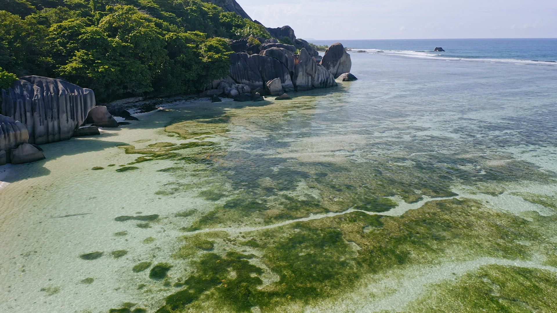 Aerial panoramic footage of tropical paradise beach Anse Source d'Argent. La Digue Island, Seychelle