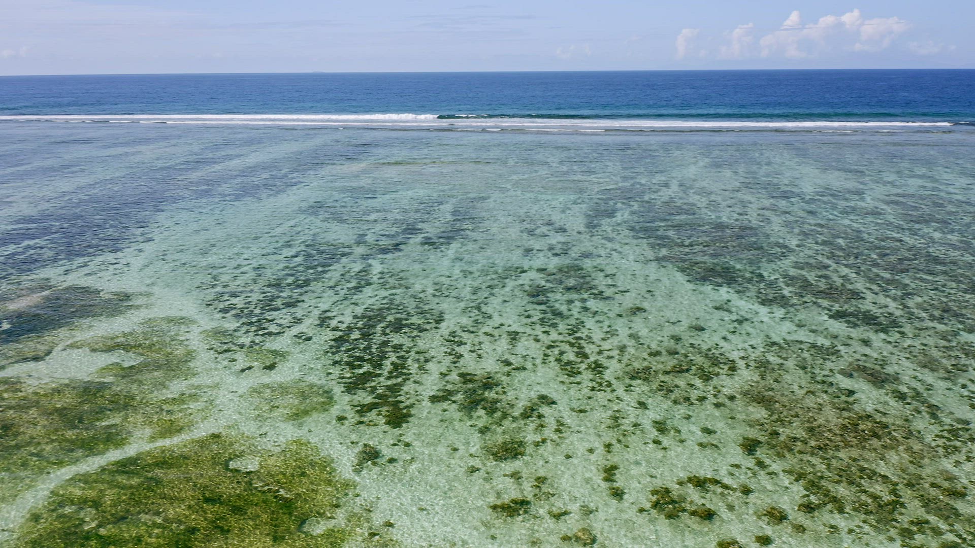 Aerial panoramic footage of tropical paradise beach Anse Source d'Argent. La Digue Island, Seychelle