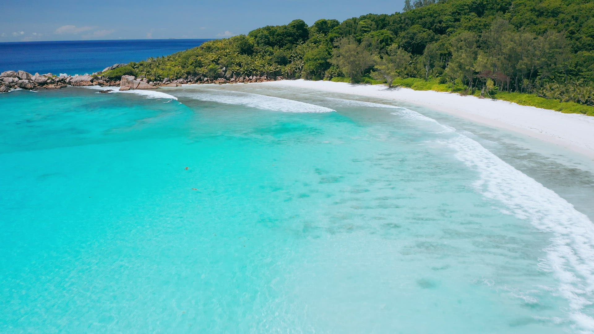 Seychelles La Digue Island. Aerial fly above blue lagoon of most beautiful tropical beach anse Cocos