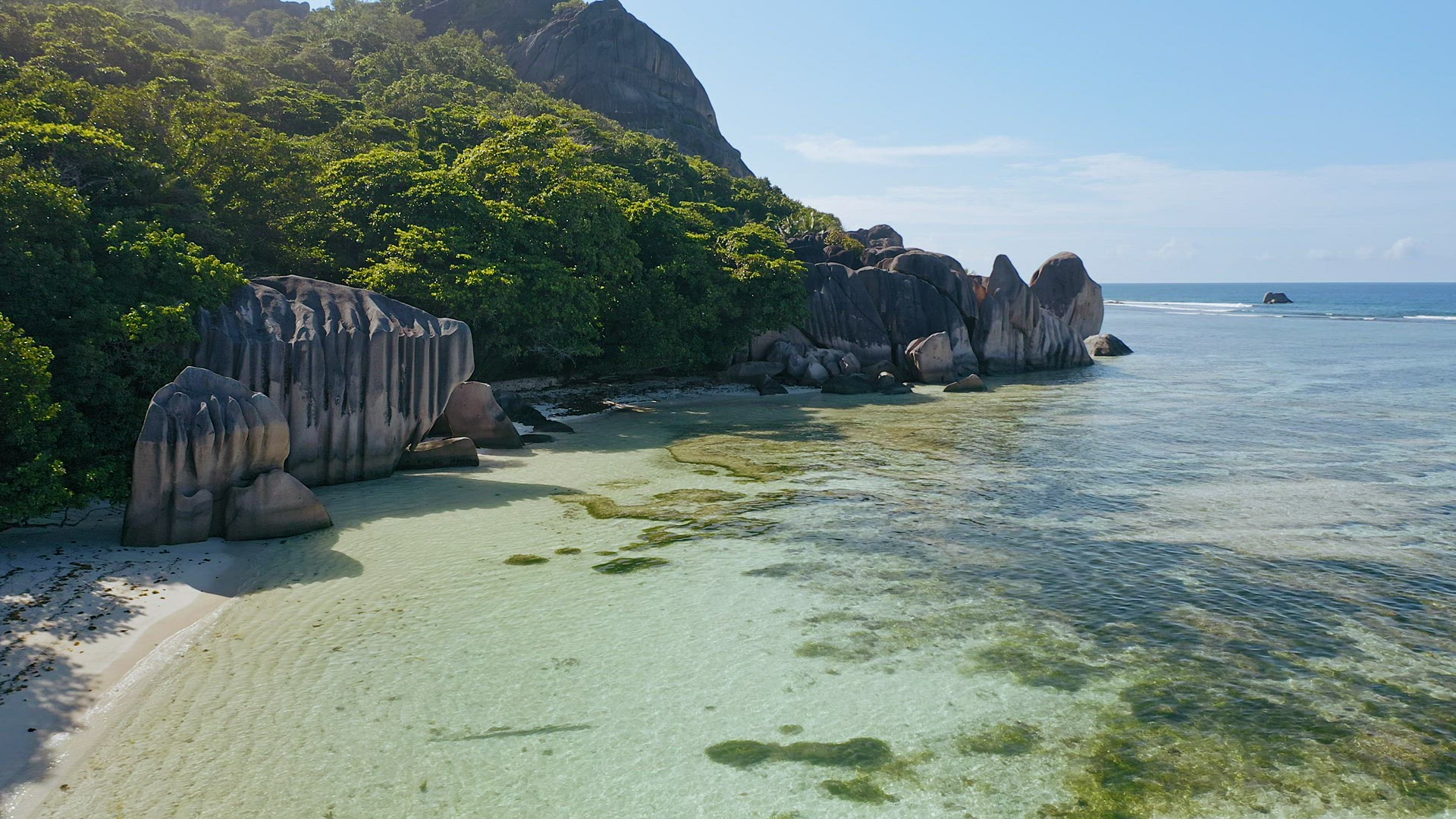 Anse Source d'Argent. La Digue Island, Seychelles. Aerial low altitude footage of tropical paradise 