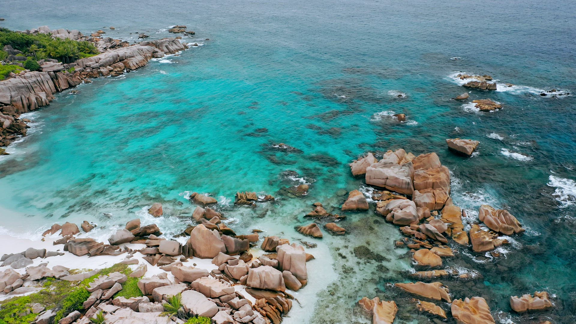 Aerial drone 4k forward flight towards hidden idyllic tropical beach Anse Marron at La Digue island.