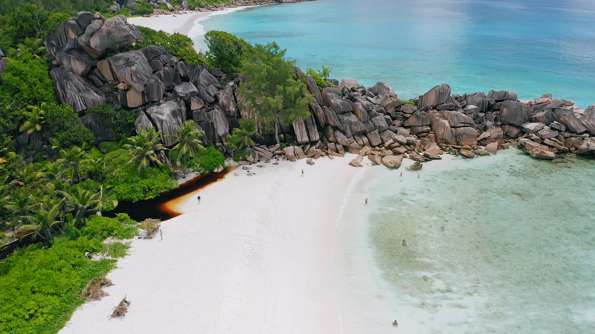 Aerial footage of unique huge granite boulders ridge made by nature and surrounded by paradise white
