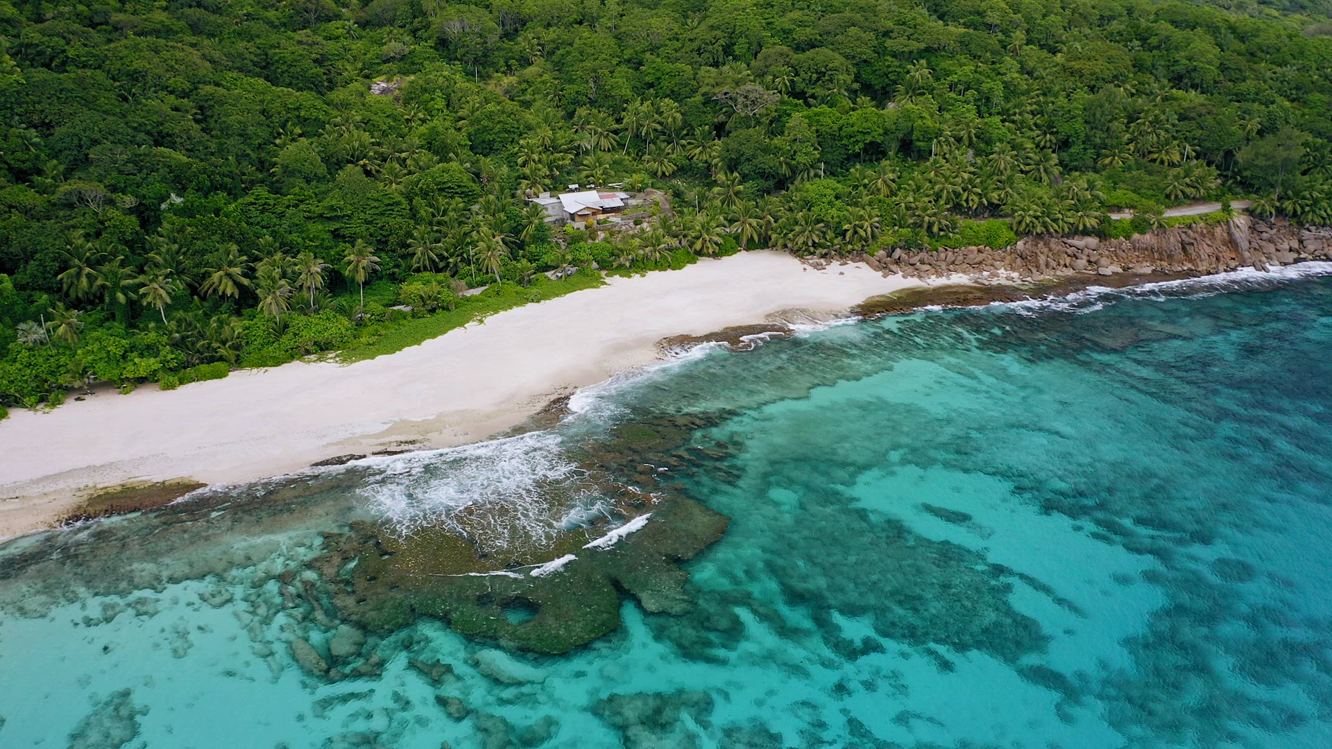 Epic aerial drone 4k footage of tropical paradise beach located on Mahe island. White sand, crystal 