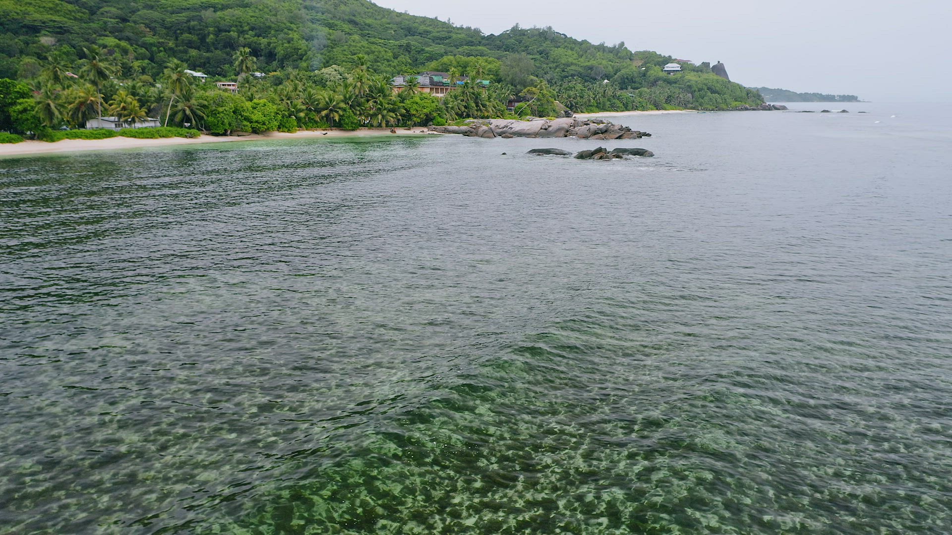 Mahe Island, Seychelles. Aerial view of tropical coast with ocean shallow lagoon of Anse Forbans bea