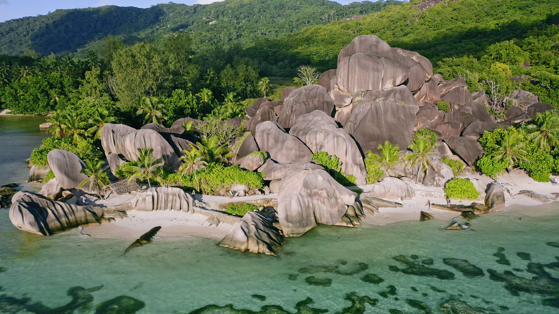 Aerial drone footage of the tropical and beautiful Anse Source D'argent beach in the Seychelles