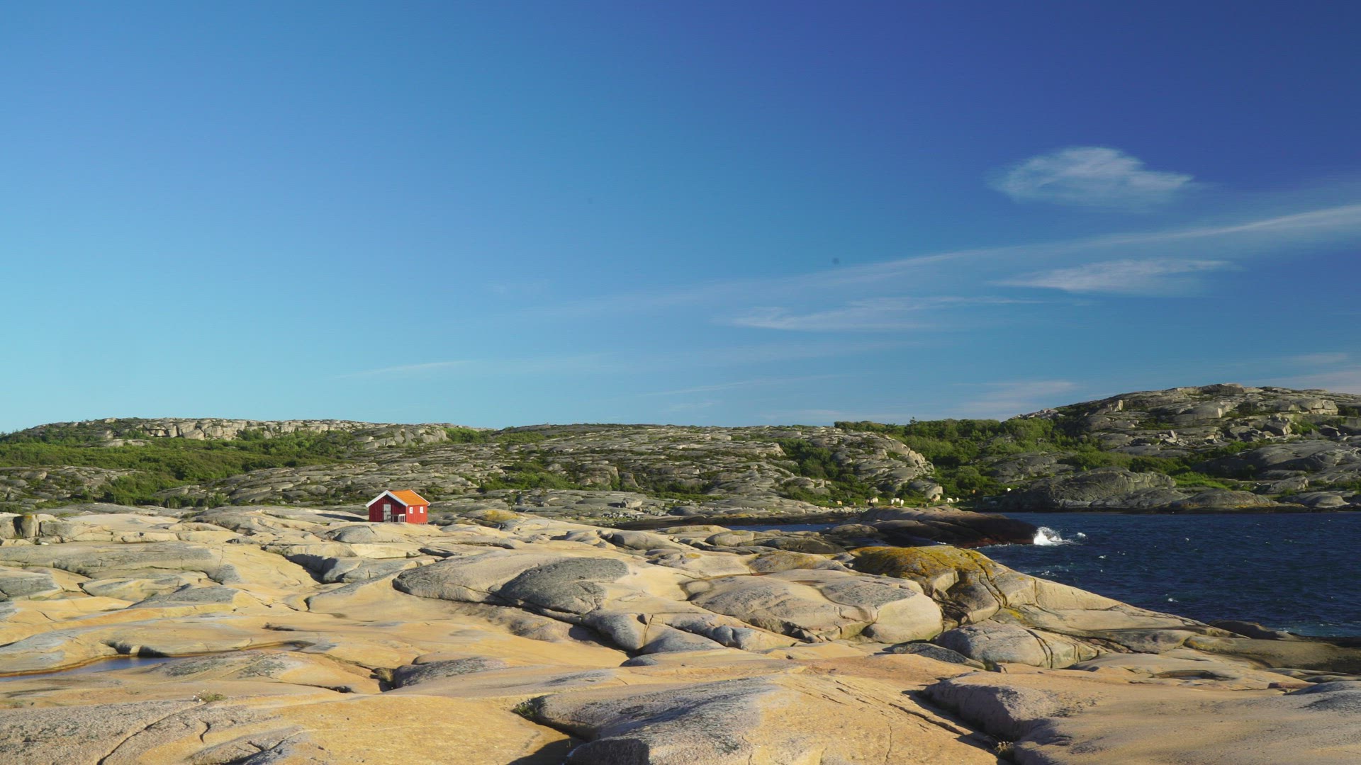 cliffs close to sea - small red house